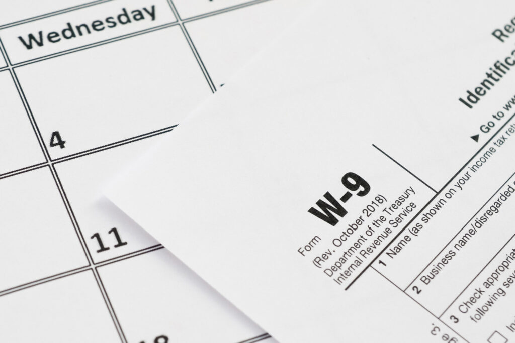 What is a Form W-9, and why should I request it from vendors before year-end?